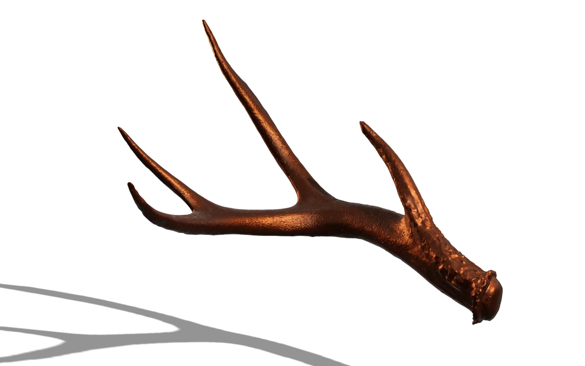 The same antler form, cast in metal.
